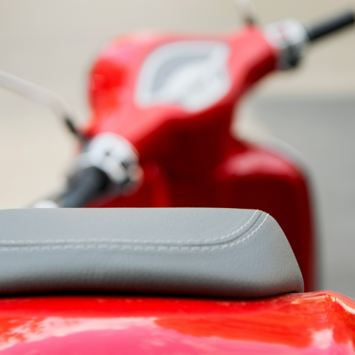 Photo of a red scooter.
