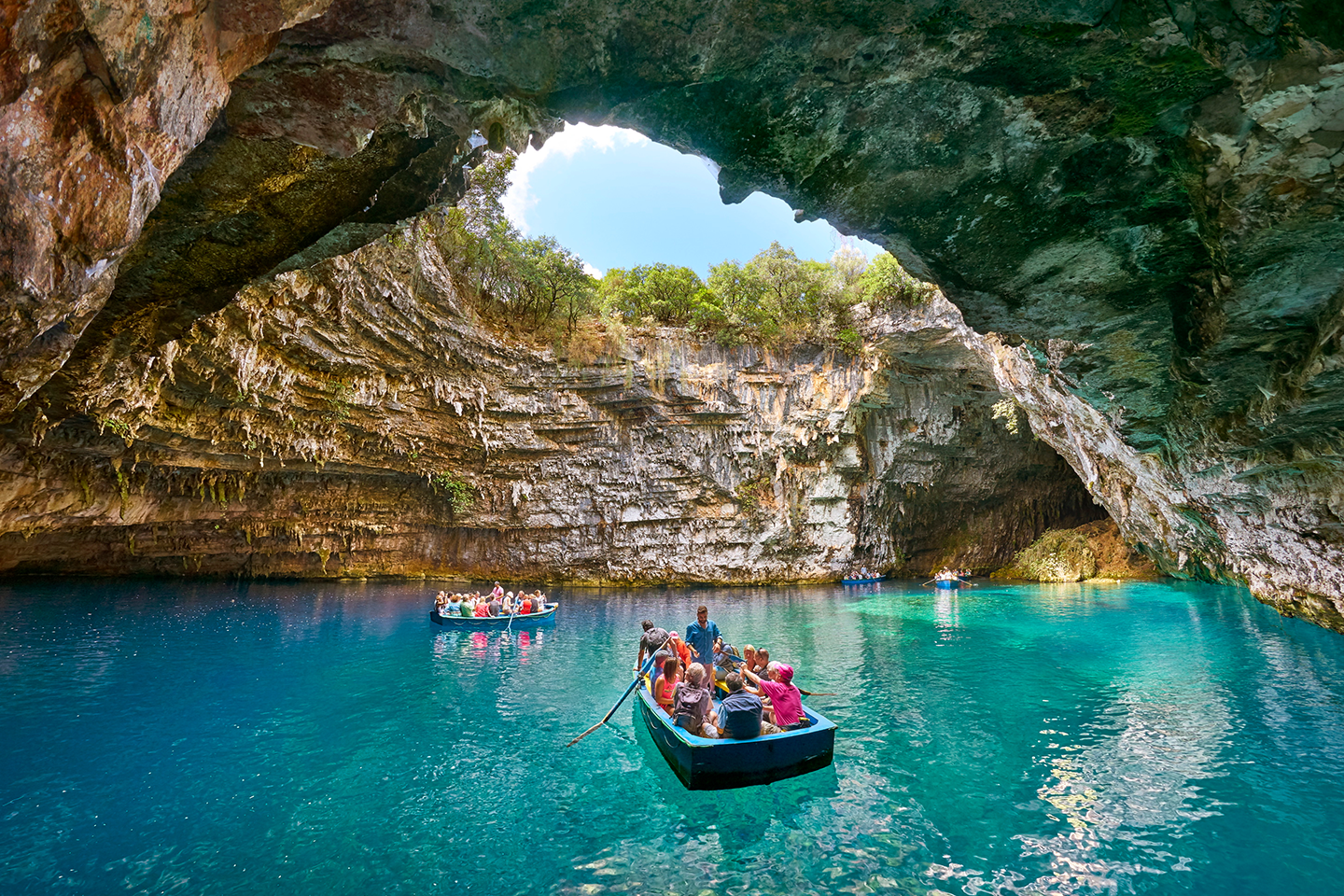 Boats in the cave of Melissani in Sami.
